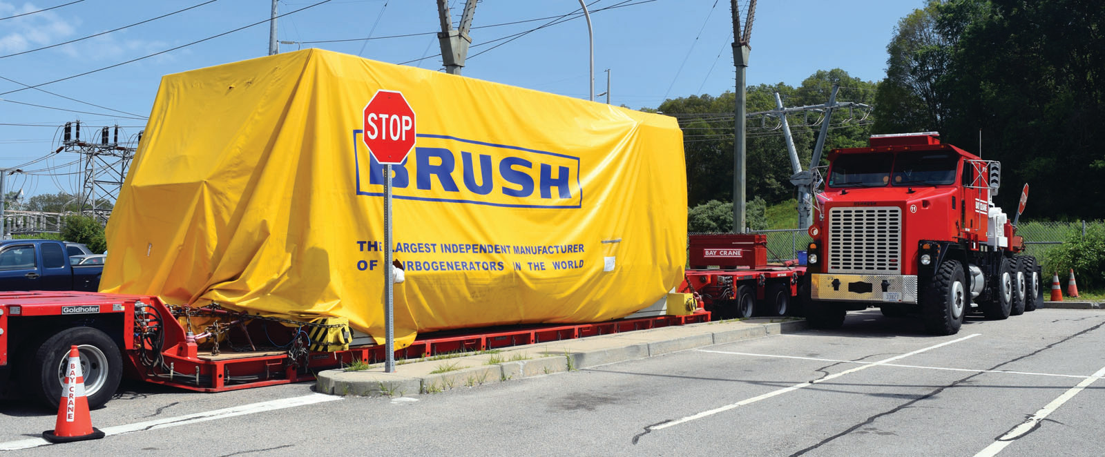 DEAD FREIGHT: The huge, 16-axle truck, managed by Bay Crane Service Inc. and carrying a 560,000-pound generator, seen Monday afternoon parked where it had sat since being pulled over on I-95 in Warwick on June 27.