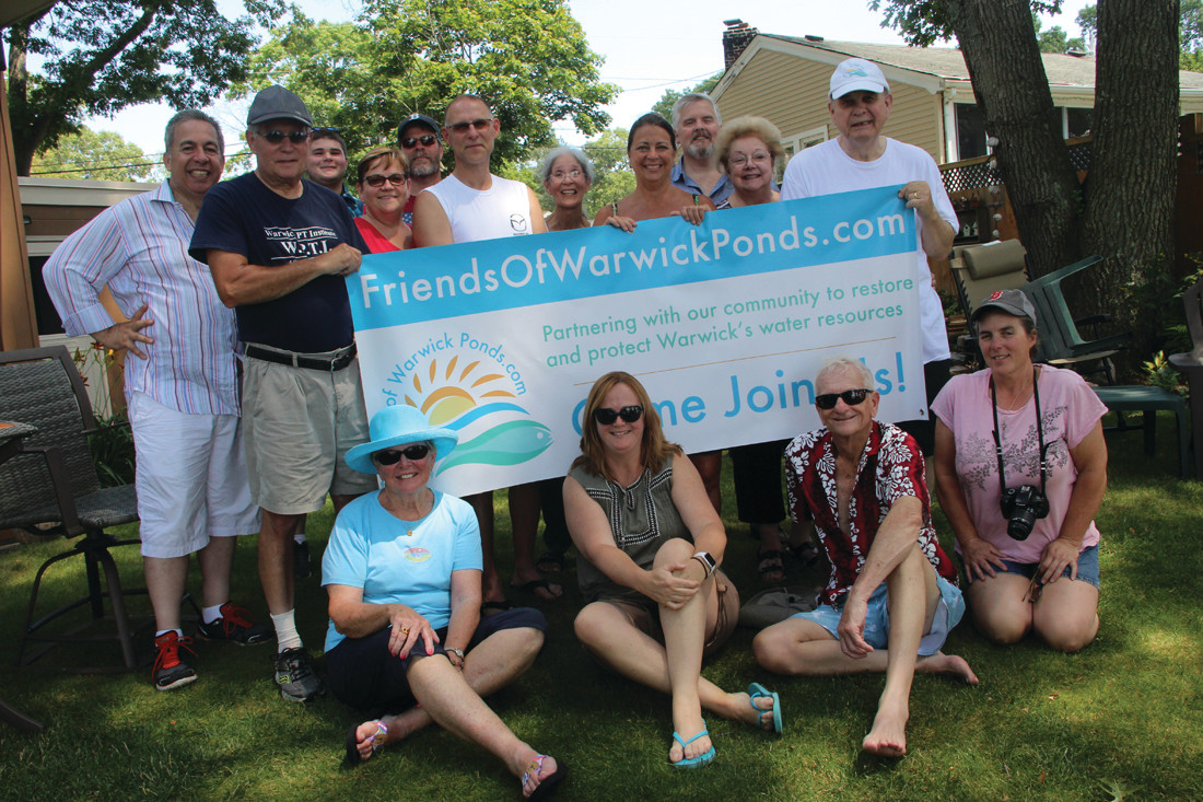 SUMMERTIME MEETING: Members of the Friends of Warwick Ponds gathered at the DeNuccio residence for a picnic after congregating by boat, kayak and canoe at the center of Warwick Pond for a meeting Sunday.
