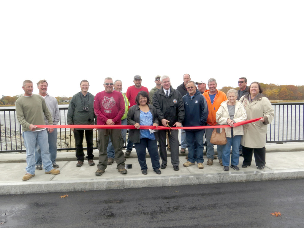 DANGER NO MORE: The workers from the Warwick Department of Public Works, along with Warwick Mayor Scott Avedisian, City Council President Donna Travis, and Department of Public Works Director Dave Picozzi, celebrated the official completion of Danger Bridge in Oakland Beach on Friday afternoon. Travis and Avedisian both thanked the workers for their time completing the bridge, on schedule and under budget.