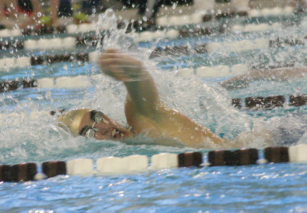 Hendricken’s James Manni swims the 100 freestyle on Sunday.