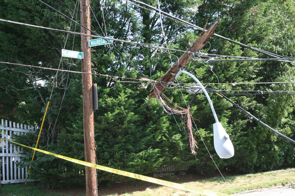 ROOT OF THE PROBLEM: Downed wires and transformers like these at the intersection of Pocahontas and Wauregan Drives couldn’t be restored until downed trees and limbs were removed.
