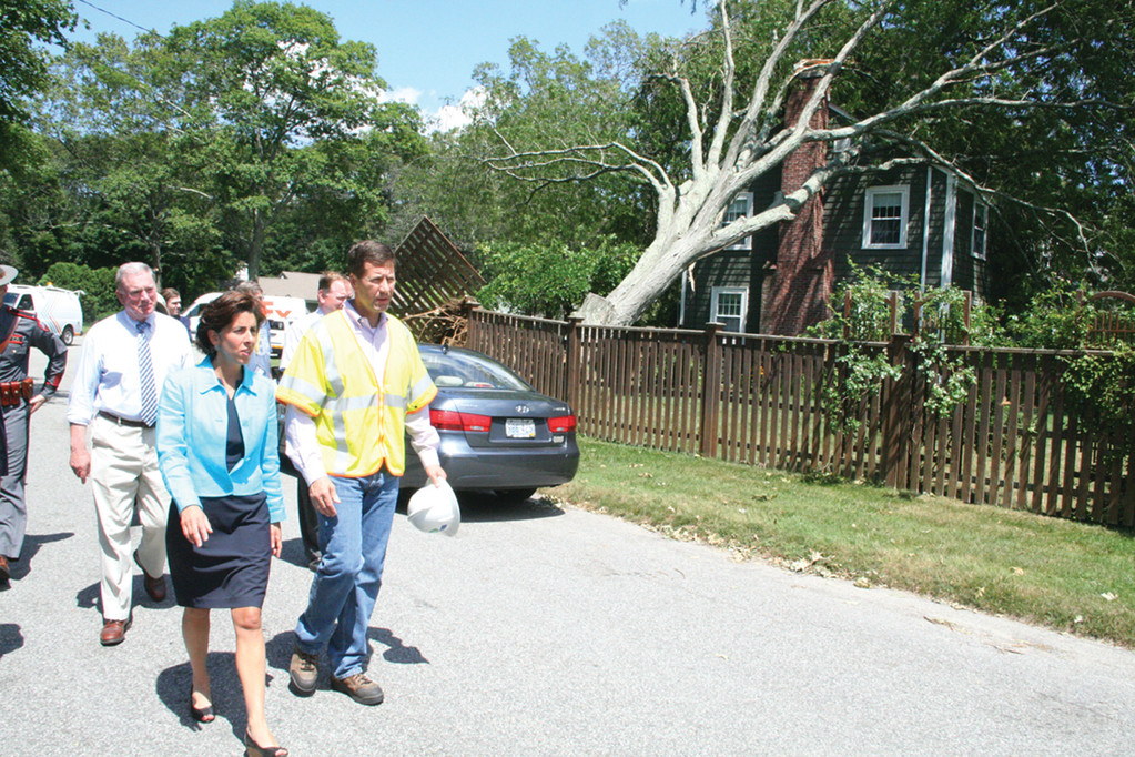 DISASTER TOUR: Governor Gina Raimondo, accompanied by National Grid Rhode Island president Timothy Horan and local officials including Rep. Joseph McNamara, viewed Governor Francis Farms damage yesterday afternoon.