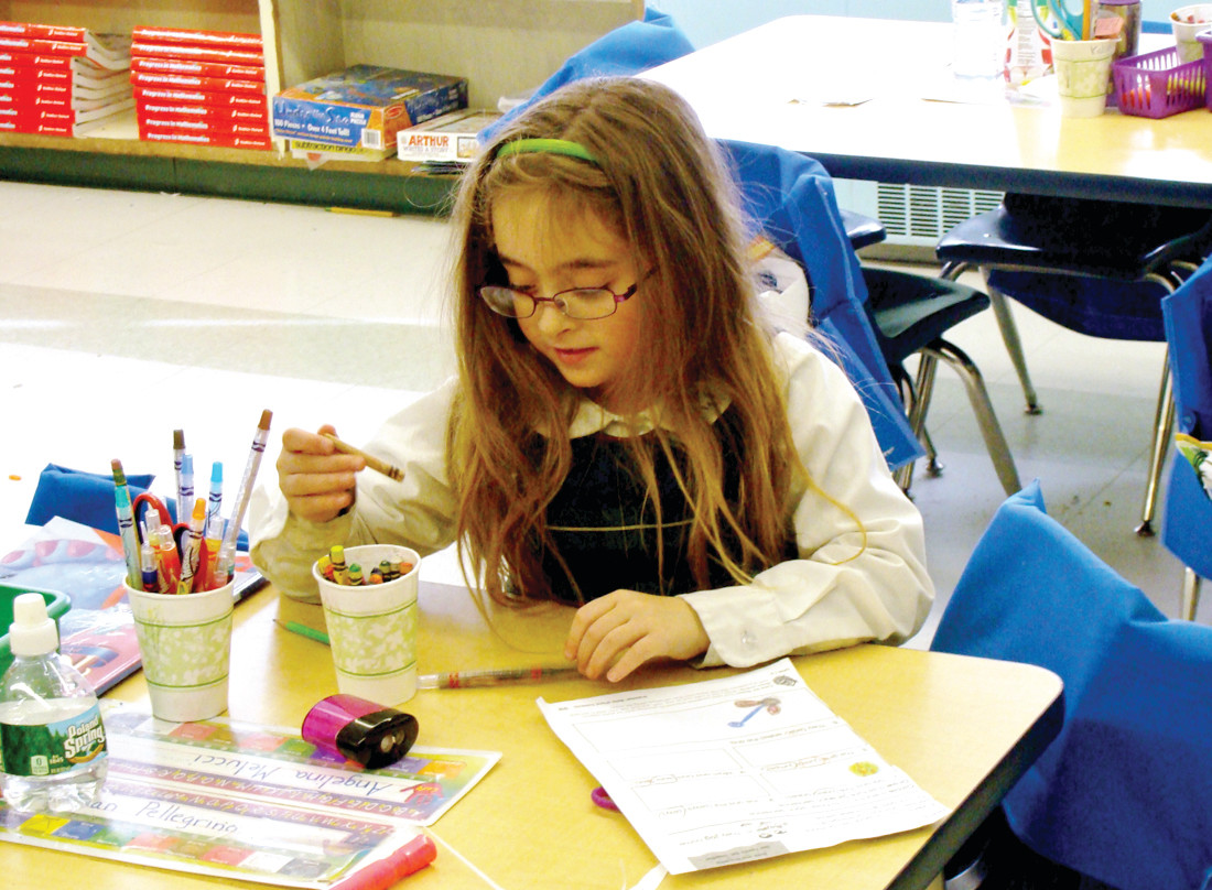 HARD AT WORK: Angelina Melucci, a first grader in Mrs. Shults class, is just one of more than 200 students who receive a catholic education at St. Kevin School.