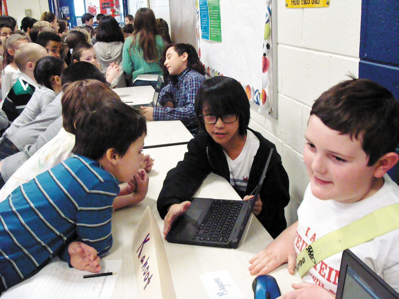 KAHOOT: Brandon Pham and Jacob Hamilton taught younger students all about Kahoot, which lets teachers and students alike to create, play and share their own educational games.
