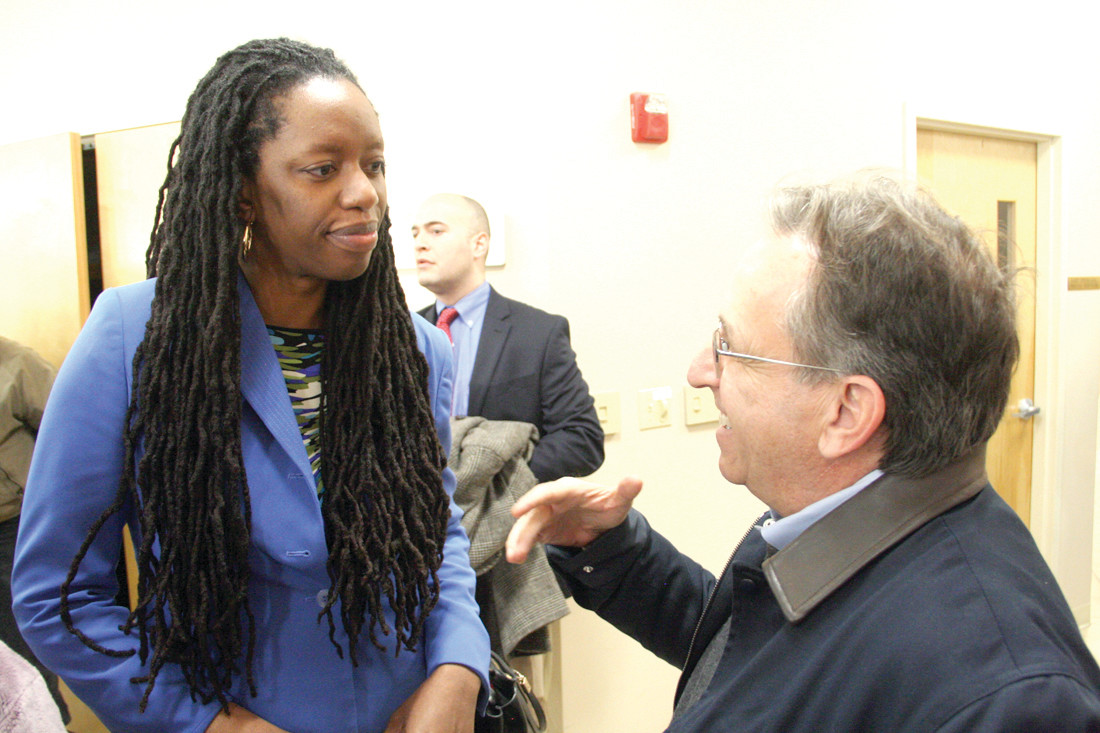 HEALTH IS ON THEIR MINDS: Dr. Nicole Alexander-Scott, director of the state Department of Health, and Sen. Josh Miller of Cranston talk about health issues at Sunday’s rally.
