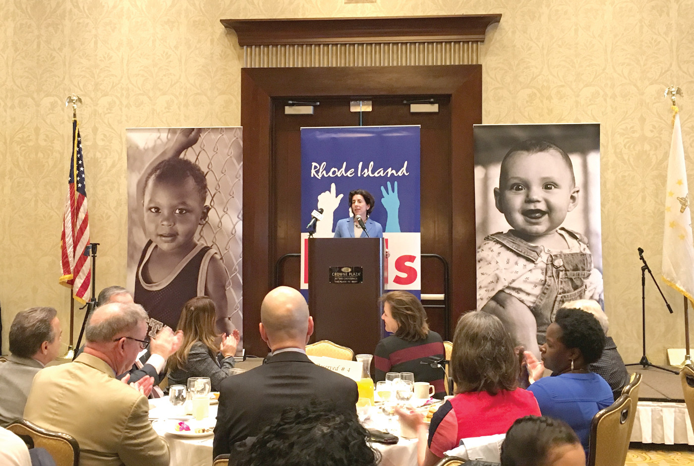 “GET WITH ME ON THIS”: Governor Gina Raimondo spoke at a Rhode Island Kids Count breakfast at the Crowne Plaza on Monday, saying data released in their annual factbook makes the case for passing her free tuition plan Rhode Island Promise.