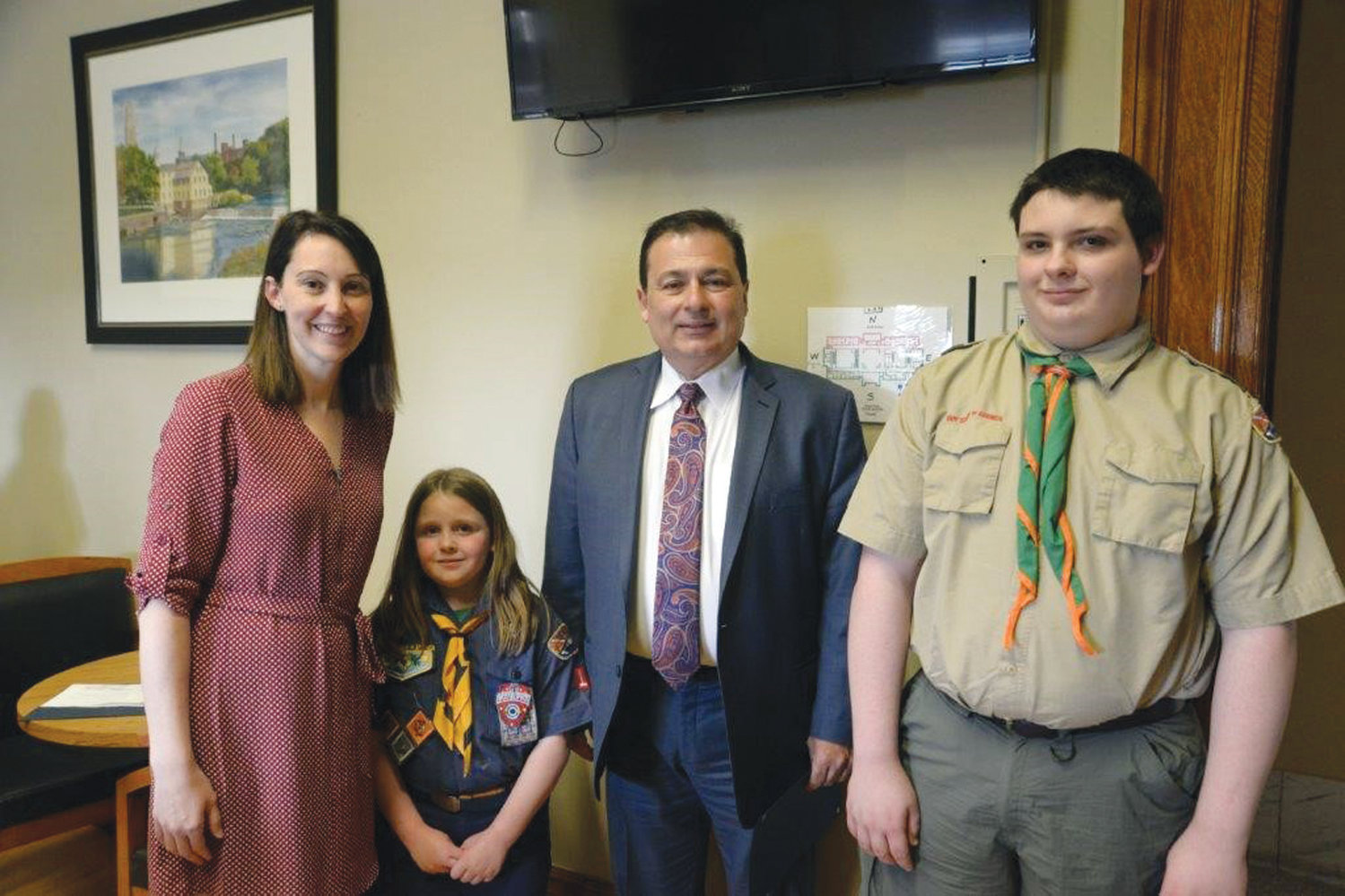 LEADING THE PACK: Tiffany Bumgardner-Scheffler, Director of Field Services/COO of the Narragansett Council; Justina Ladino; Majority Leader Shekarchi and James Ladino pose during the recent Narragansett Council, Boy Scouts of America (NCBSA) tour of the State House.