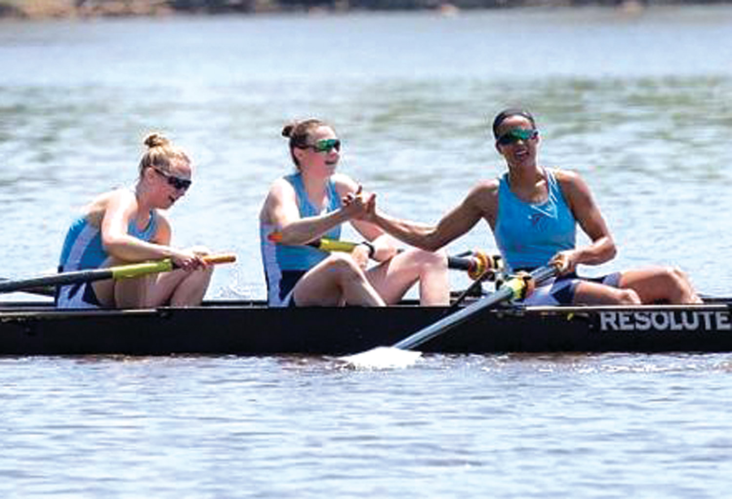 ON THE WATER: Members of the URI women’s crew team, including Erika Pena (far right) compete during this past season.
