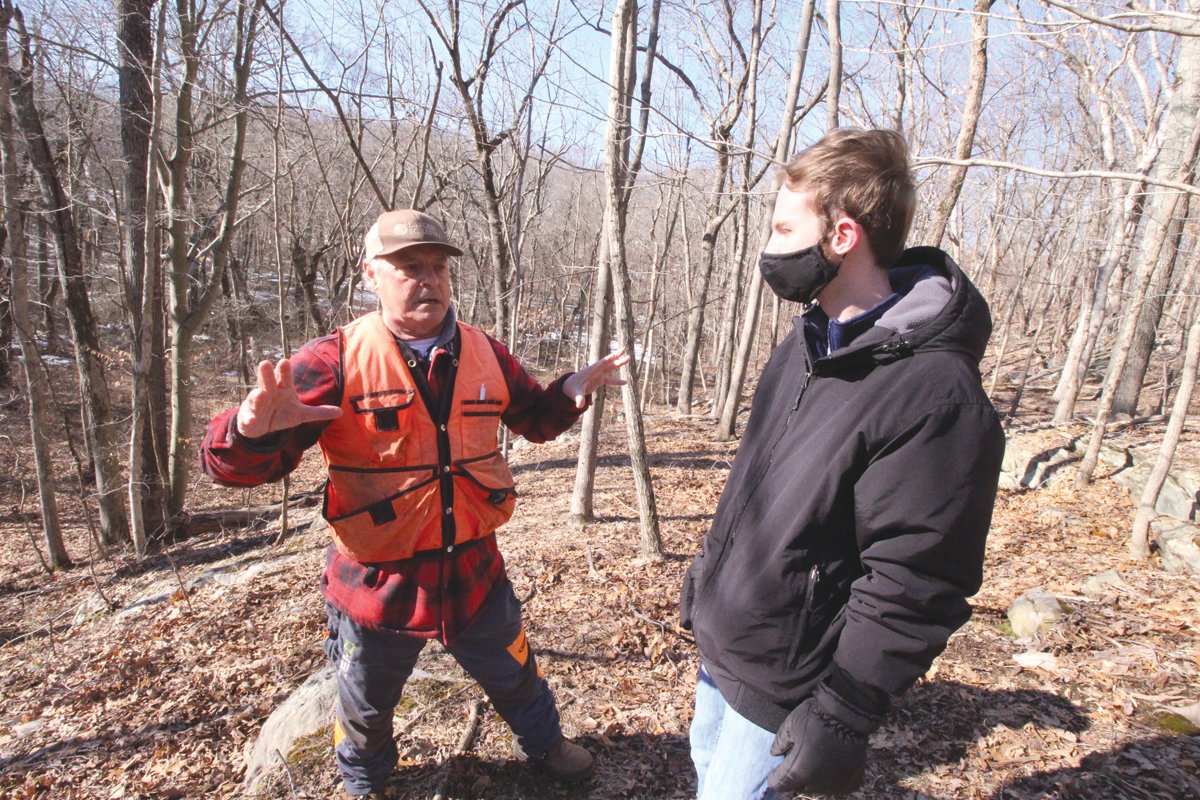 CANYON TREES: Arborist and forester Matthew Largess, left, and Nathan Cornell of Warwick explore a wooded canyon off Route 2 believed to contain an old growth forest. Cornell brought the area to Largess’s attention.