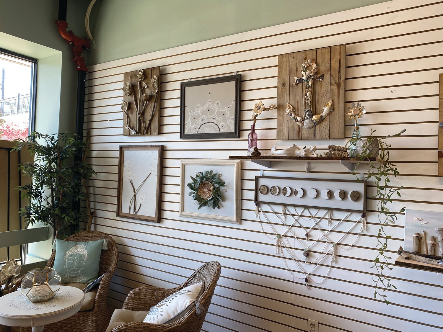  ART FROM THE EARTH:  Almonte’s art is inspired by the natural world. She uses handpicked seaglass, stones, shells, driftwood and more in her work and infuses each creation with good energy.