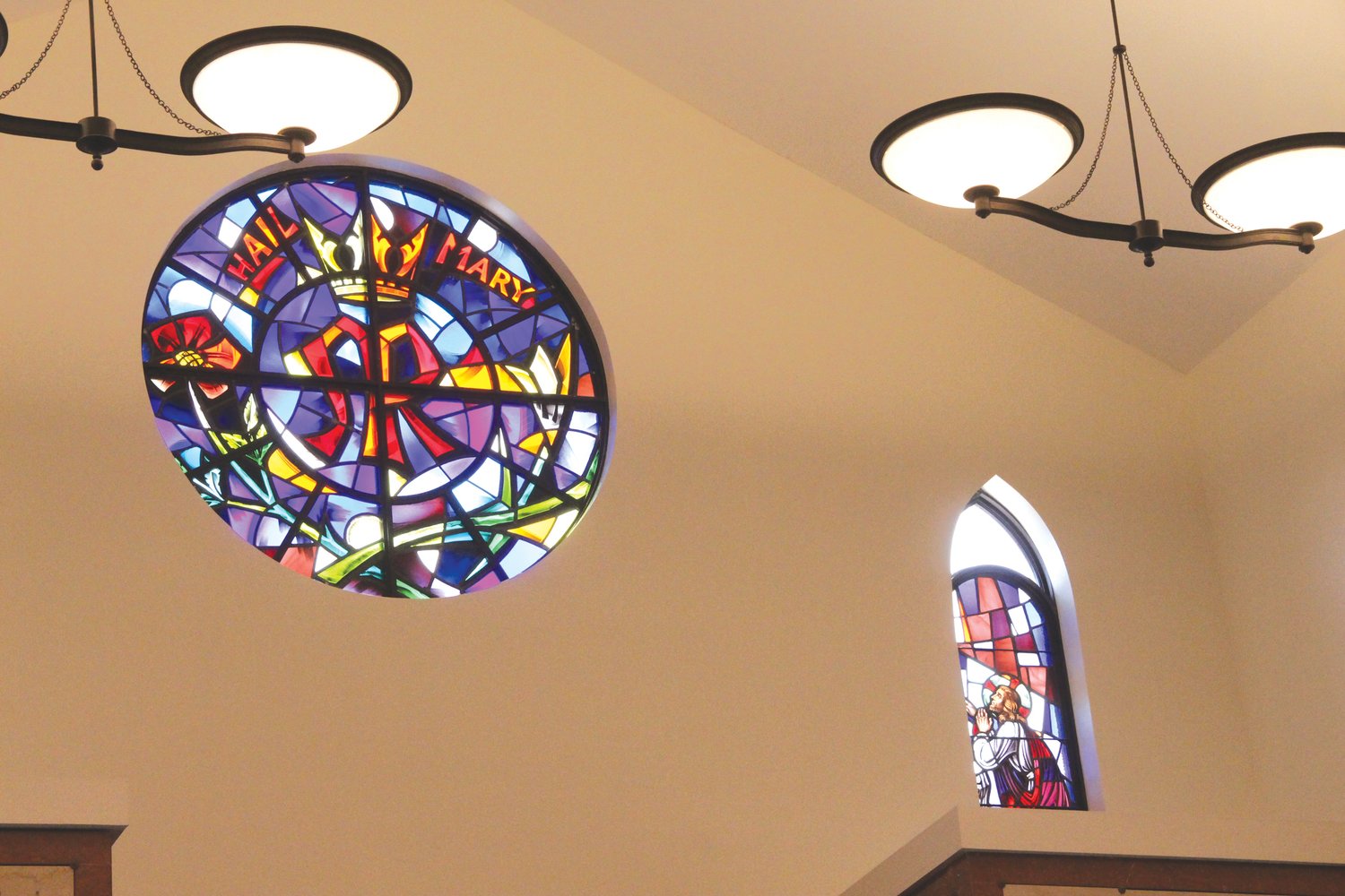 A NEW LIFE: Stained glass windows, murals and even the bell from Our Lady of St. Carmel Church on Federal Hill, which was closed in 2015, have been incorporated in the mausoleum.