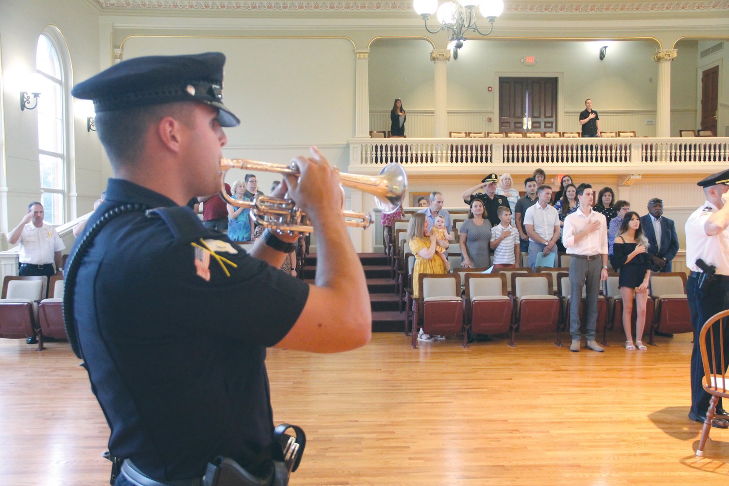 OPENING CEREMONY: Officer Oliver M. Pinheiro plays the National Anthem to open the police promotional/pinning ceremony held Aug. 10 at City Hall.
