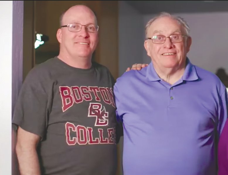 OVERCOMING THE ODDS: Paul Bayne, left, lived 21 months beyond his original diagnosis of Glioblastoma. Patients typically live only 7 or 8 months. He’s pictured here with his father, Richard.