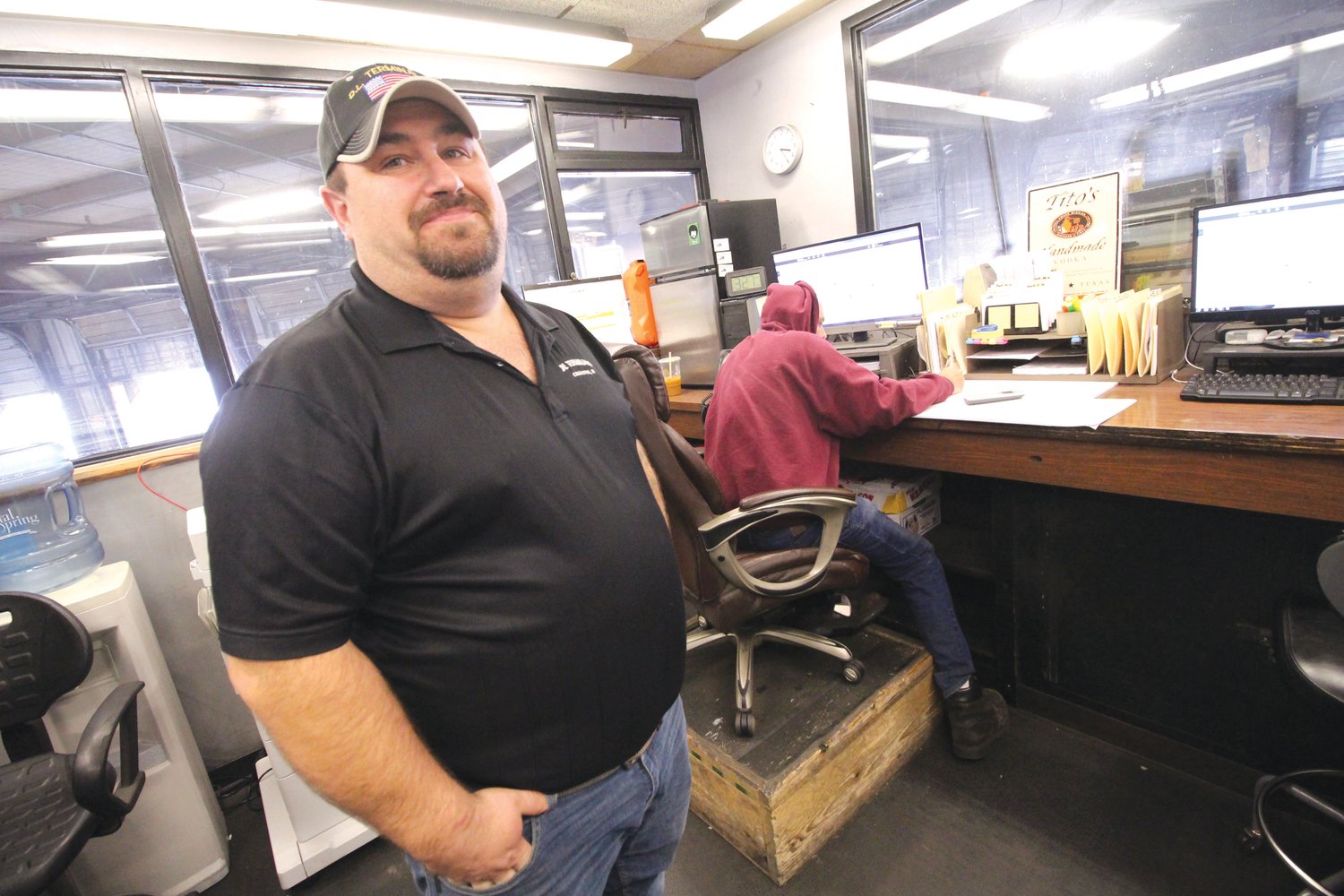 TERMINAL WHEELHOUSE:  Ryan Roche of DL Terminals in Cranston is seen in the company terminal, where he can be found most early morning hours scheduling the day’s pickups and deliveries across Connecticut, Massachusetts and Rhode Island.
