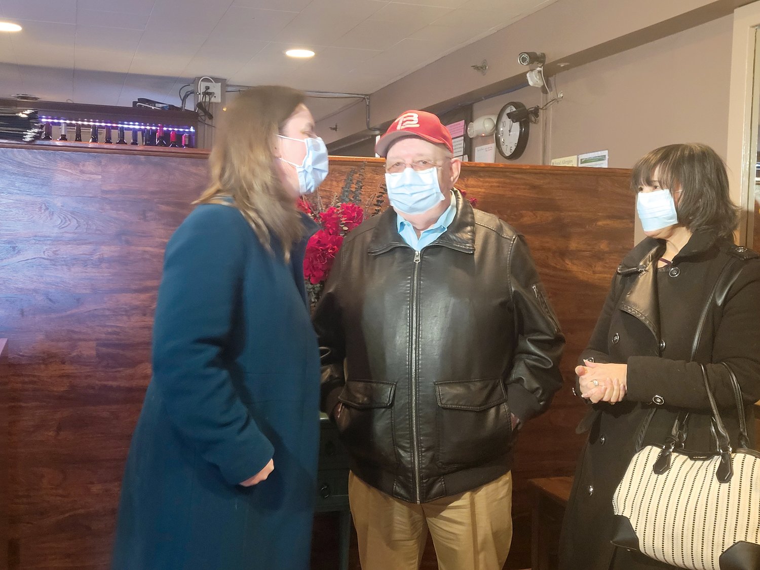 PLEASE WAIT TO BE VETTED: Joy Fox mingled with patrons waiting for tables in the Atwood Grill lobby. Fox made campaign stops throughout Rhode Island Tuesday as she pitches her run for the state’s second Congressional district seat.