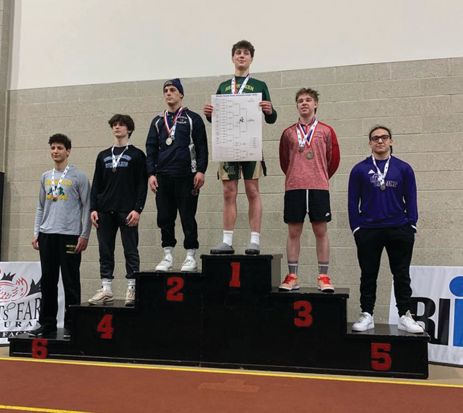 STATE CHAMP: Hendricken’s Adolfo Betancur receives his first-place medal.