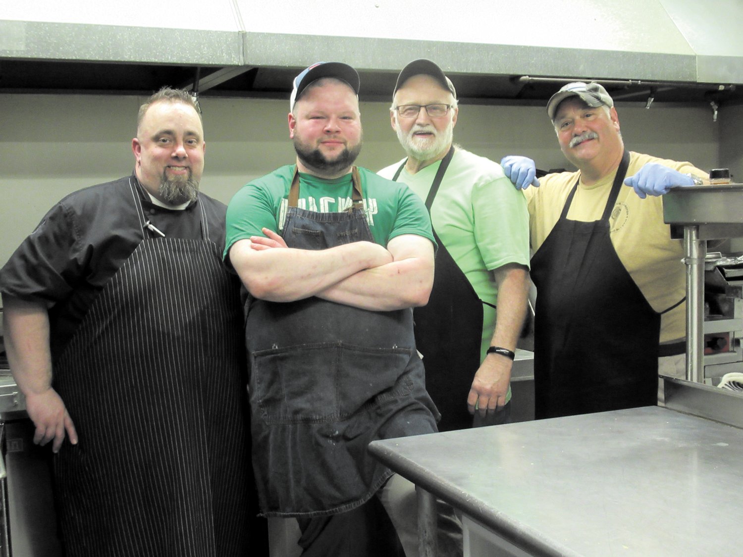 CHEF’S CORNER: Rob DeRemr, Brian Ashness, Bob Hartington and Eric Lopes prepared and cooked what people called “the best St. Patrick’s Dinner we’ve ever had” (here at the Tri-City Elks Lodge last Saturday night.”                                         Warwick Beacon photos by Pete Fontaine