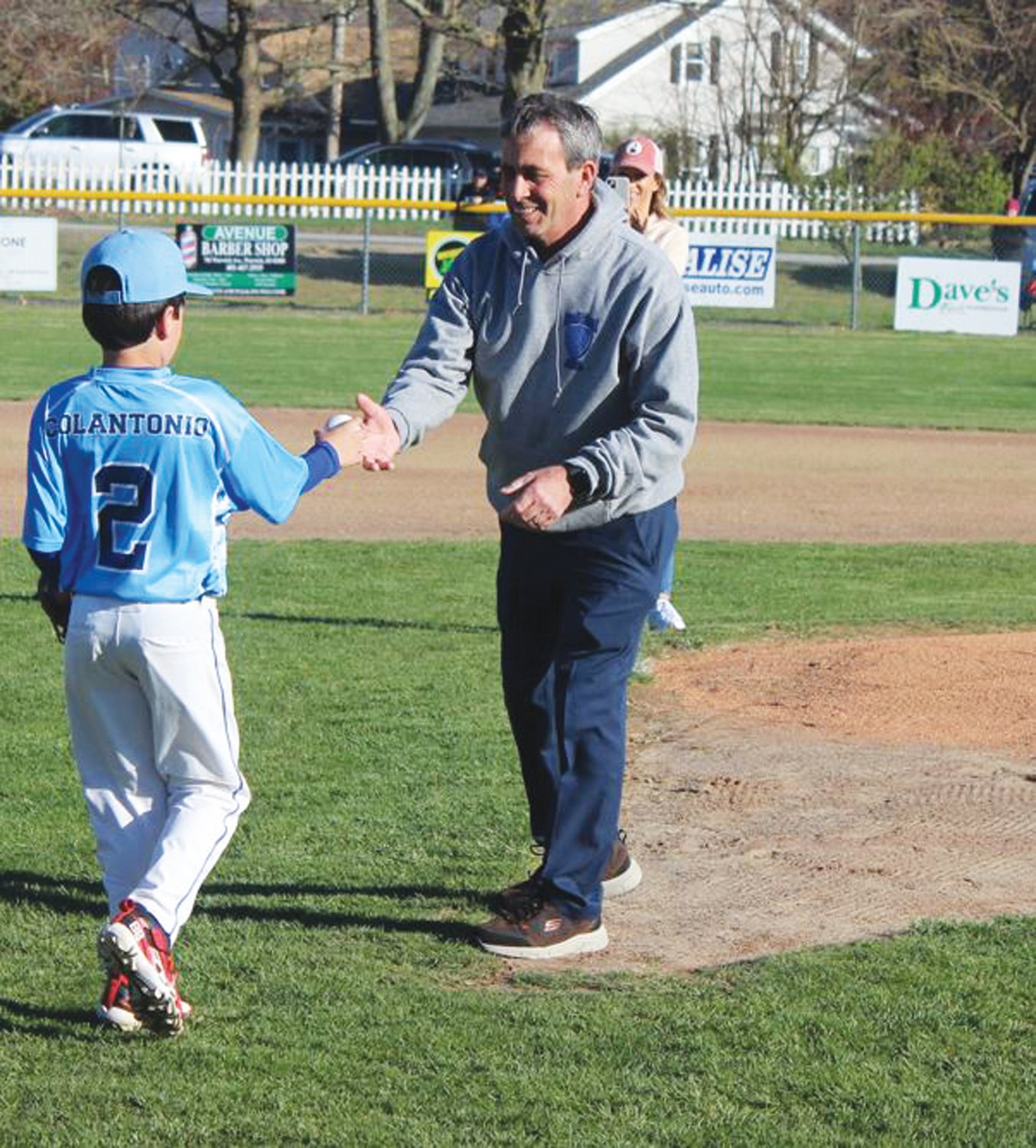 FIRST PITCH: Mayor Frank Picozzi receives the ball from Tyler Colantonio.