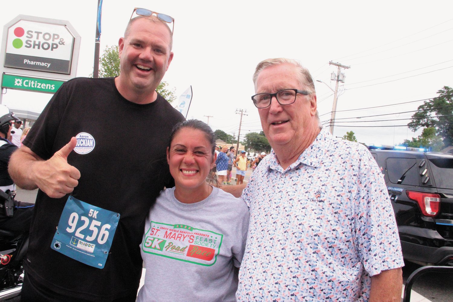 IN MORE THAN ONE RACE: Aaron Guckian, Republican candidate for Lieutant Governor couldn’t be missed in the field of 5K runners – he stands nearly seven feet tall. Here he is joined by Councilwoman Nicole Renzulli and Mayor Hopkins.