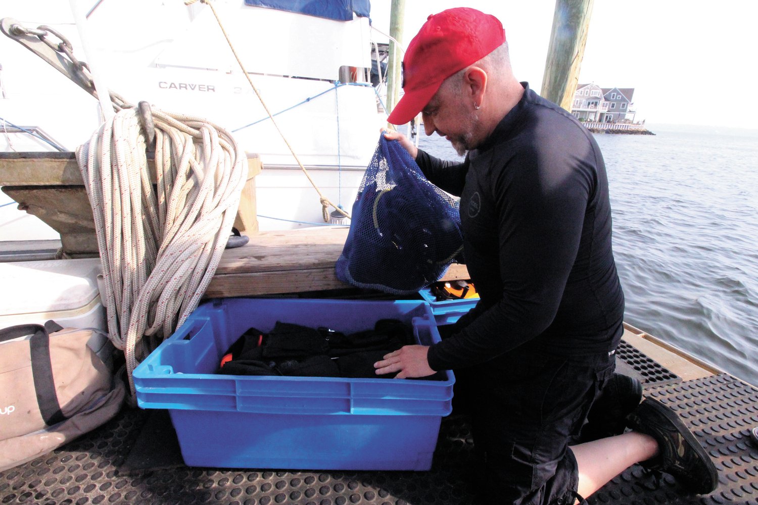 CHECKING HIS GEAR:  Peter Nulton readies for a day of diving in search for the Gaspee. Also diving Sunday were Joe Duquette and Gage Hull. Greg DeAscentis operated the vessel which he owns. (Cranston Herald photos)