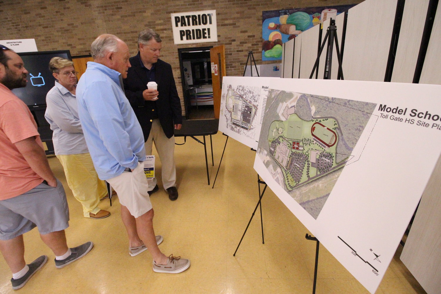 CHECKING OUT THE PLANS: Guy Dufault, who is working with Building Warwick’s Future in support of the $350 million school bond appearing on the November ballot, looks over plans for athletic fields. (Warwick Beacon photos)