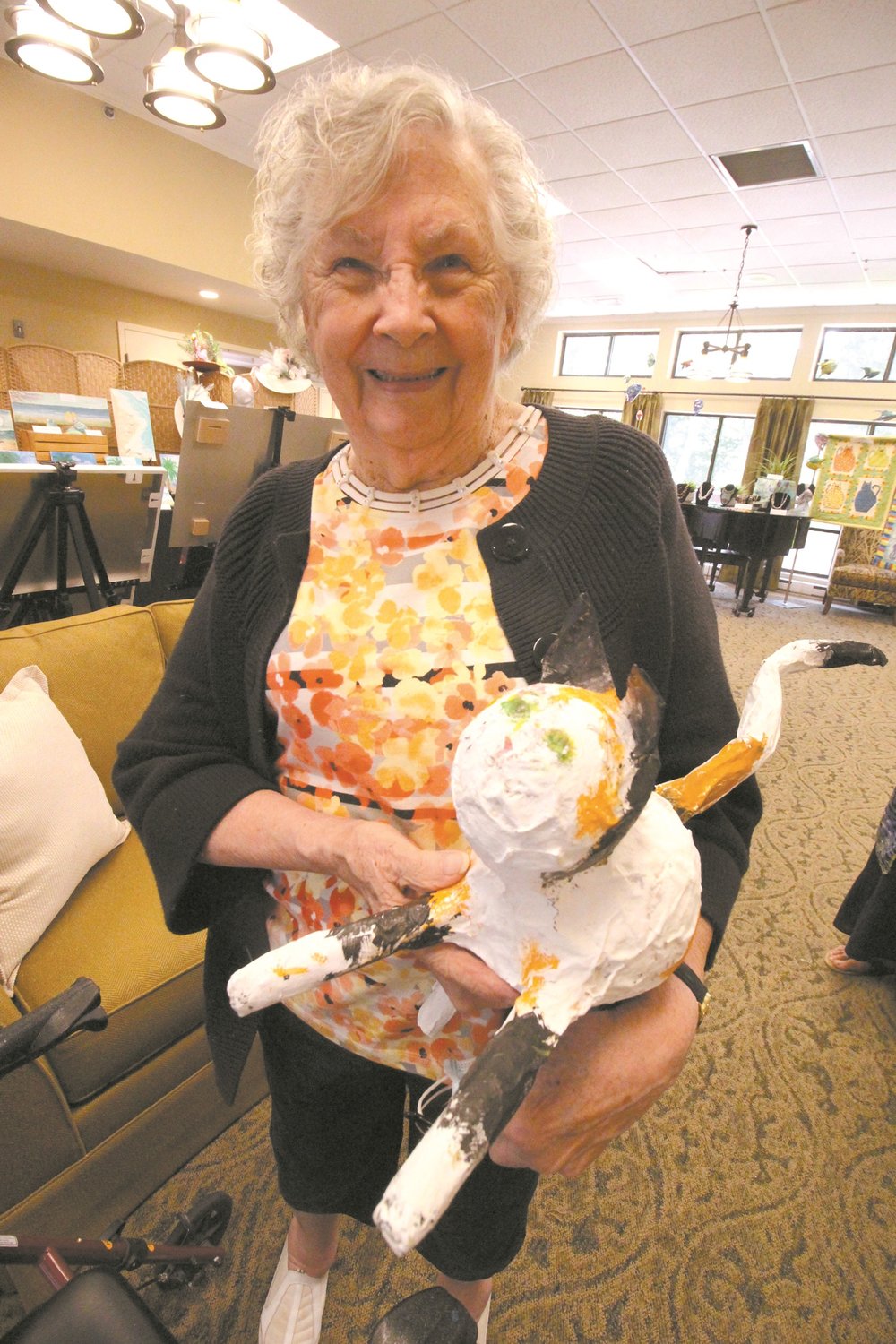 CAT IN THE HAT: Marilyn Kasparian sculpted a cat from papier mache that keeps her company.