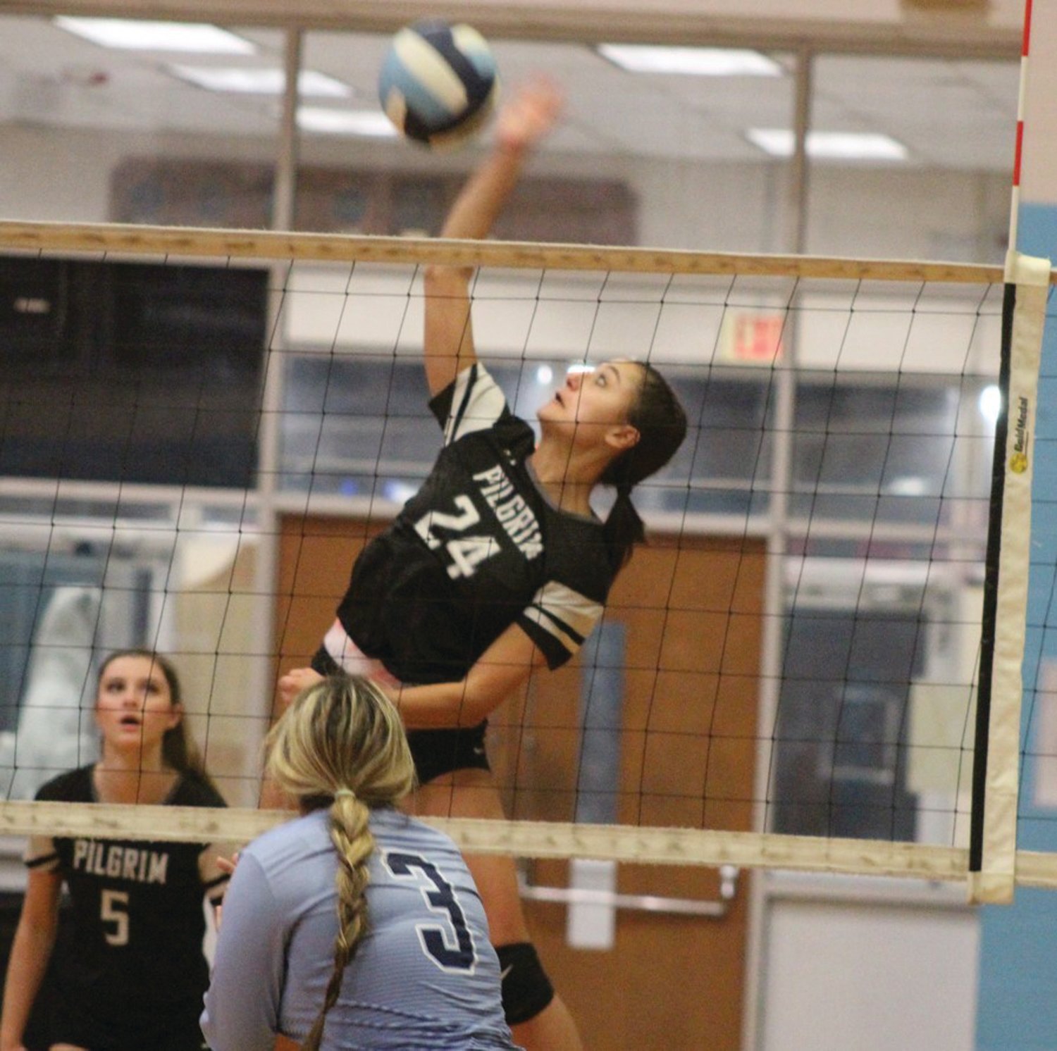 BIG OUTING: Pilgrim’s Kaleigh Catucci makes a play at the net last week.