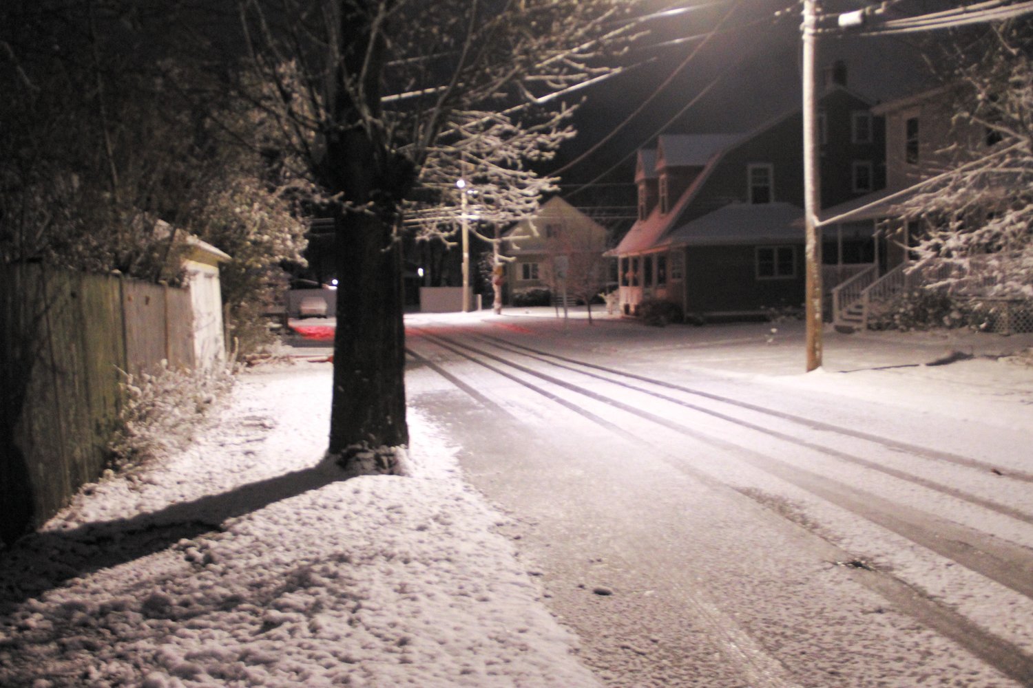 FIRST FLAKES OF THE SEASON: A view of Bellman Avenue early Monday morning. (Warwick Beacon photo)