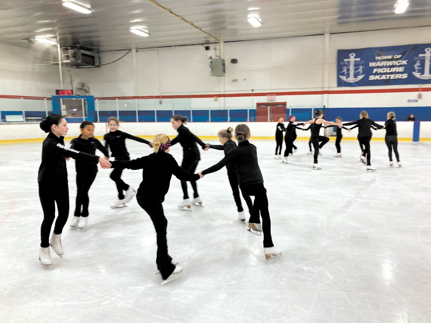 PRACTICE MAKES PERFECT: The Snowflakes practice their routine at the Thayer Arena.