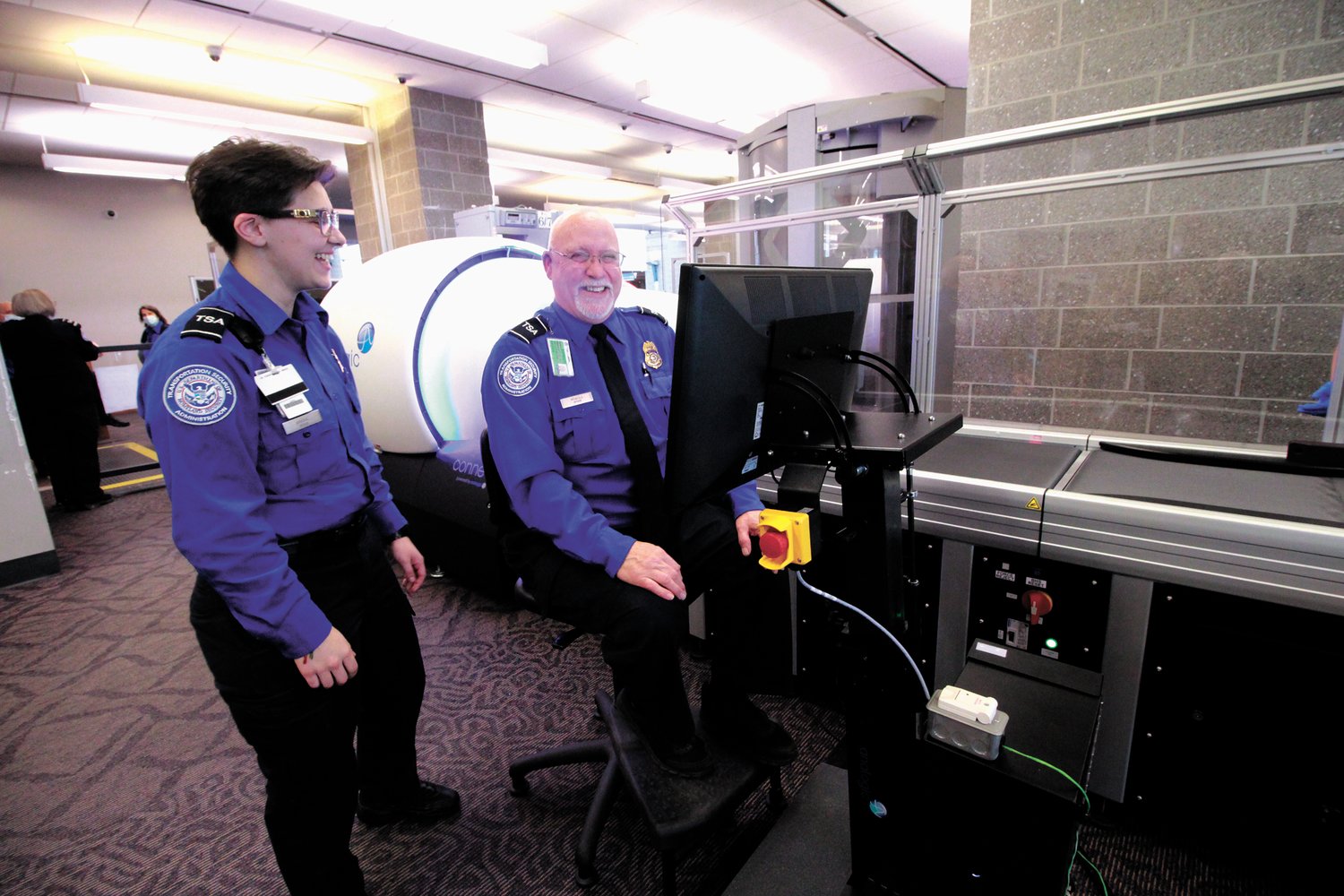 MAKING SECURITY CLEARANCE EASIER: Transportation Security Officers train on one of the new Computed Tomography (CT) systems at Green Airport. The scanners provide a 3D view of carry-on bag contents eliminating the need to individually scan or individually examine some items including laptops. (Warwick Beacon photo)