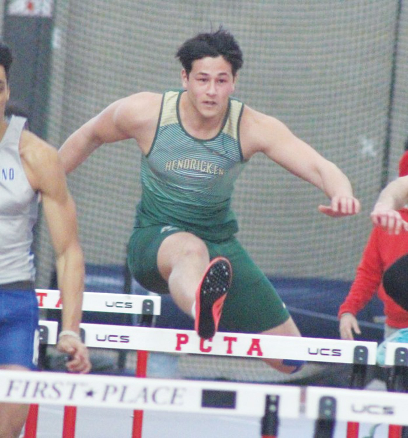 HURDLES: Bishop Hendricken’s Josiah Nhar competes in the 55 meter hurdles on Saturday afternoon at the RIIL Indoor Track & Field Class Championships. Nhar finished in sixth place in the event and the Hawks would go on to win the team title. (Photos by Alex Sponseller)