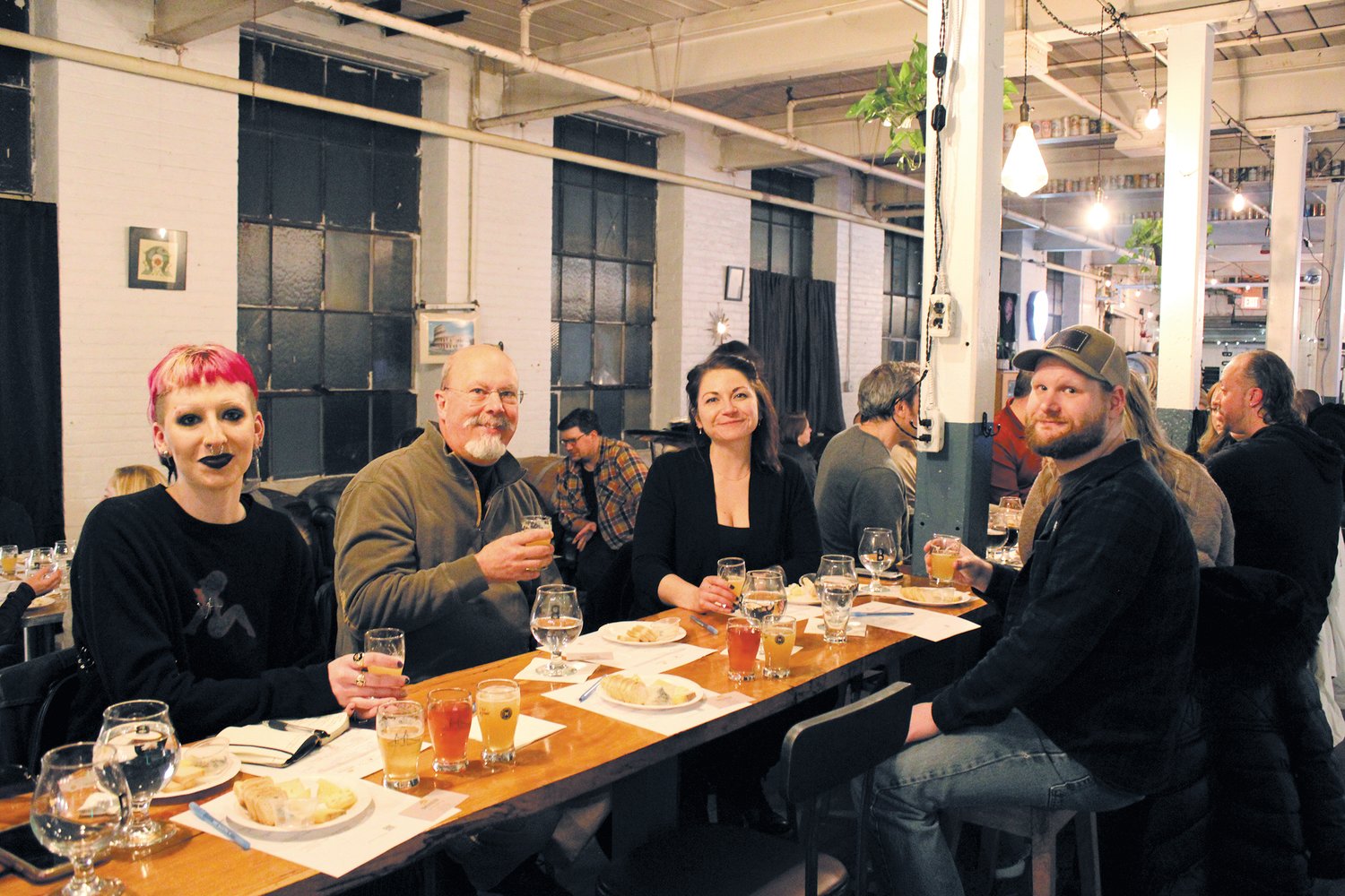 ENJOYING THE NIGHT: Laine Hodgkinson, DJ Johnson, Katie Truchon and James Freeman (left to right) take their time discussing and making notes while enjoying the tasting.
