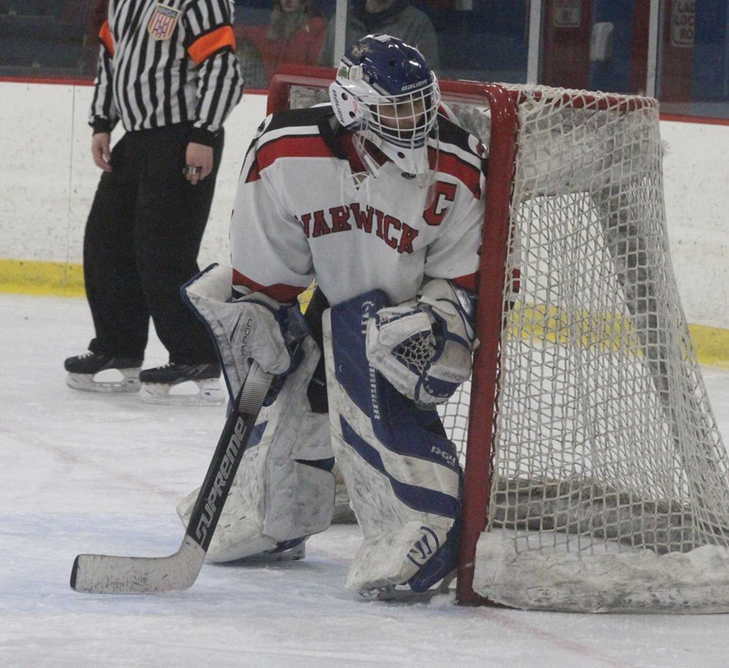 IN NET: Warwick girls hockey goalie Mary Centracchio tracks the puck behind her last week in the first round of the playoffs. (Photos by Alex Sponseller)