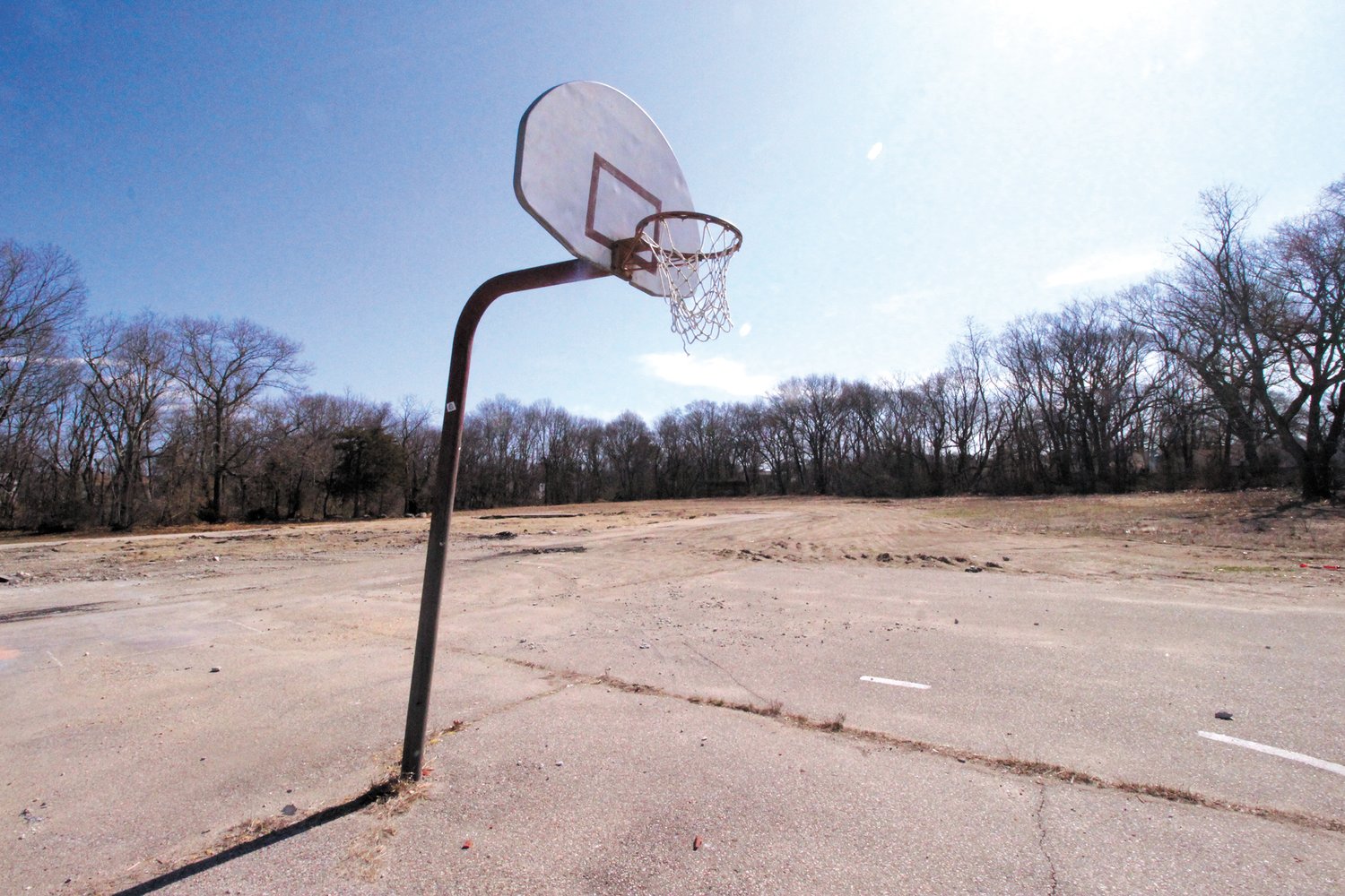 READY TO PLAY? Hoops at either end of the court are all that remain on the John Wickes School property where Link Commercial Properties has proposed development of 39 houses.