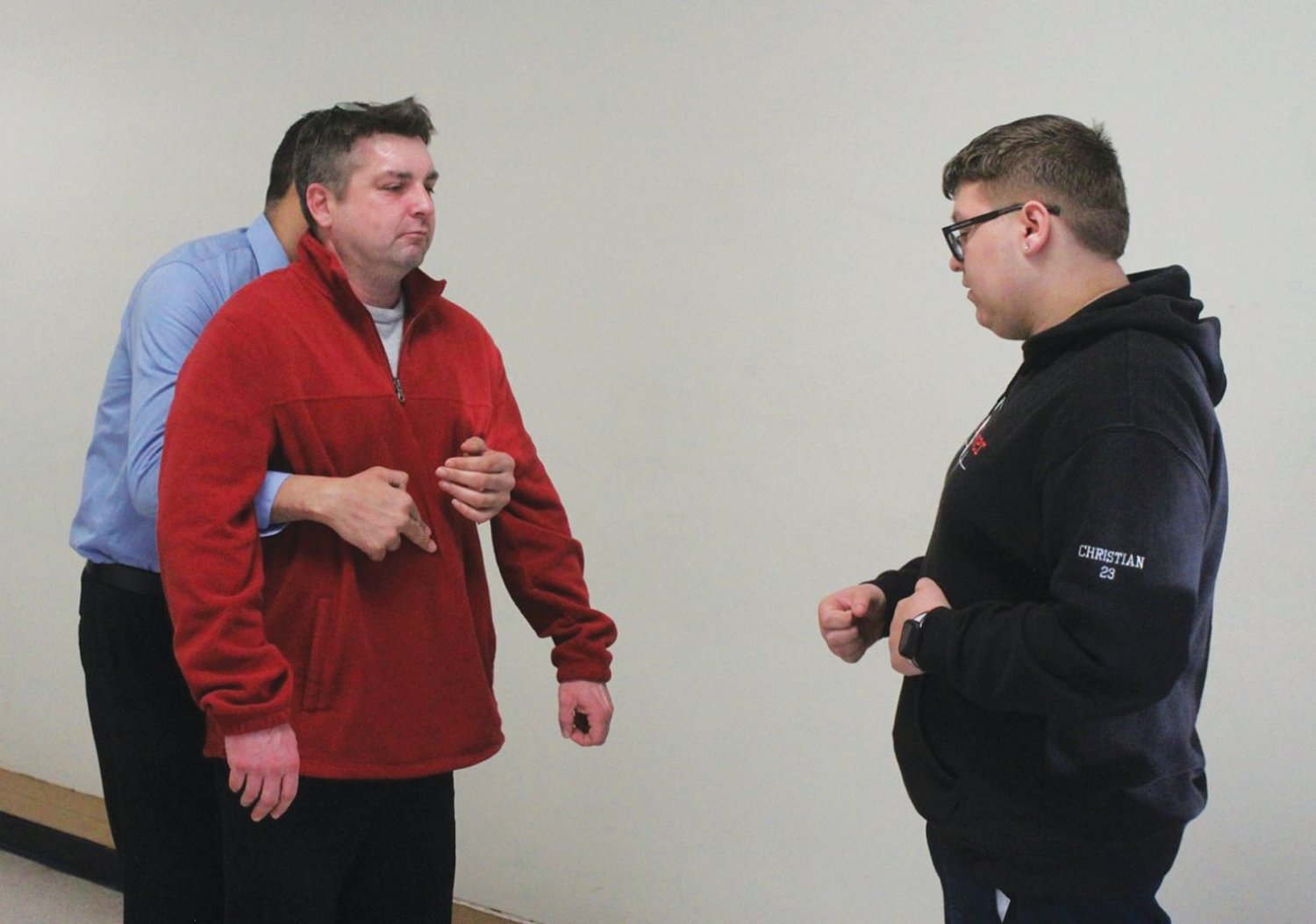 LOOKING ON: Christian LaPorte (right) instructs coaches on how to assist someone that is choking.