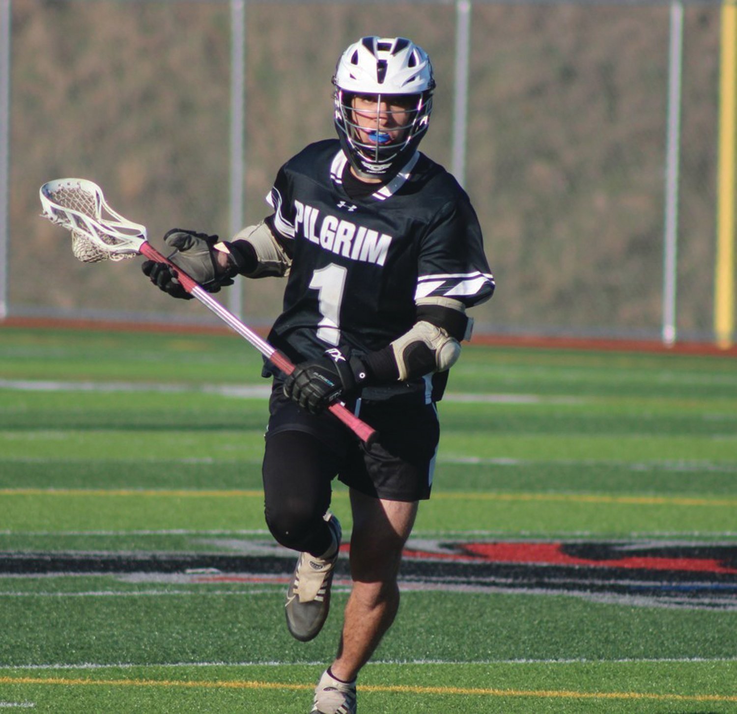 MIDDIE: Pilgrim’s John Kelly takes the ball up the field.