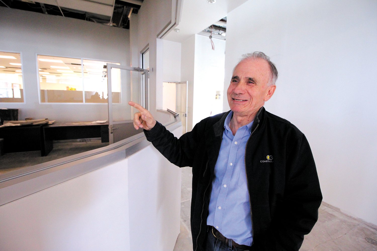 NO TOO FAR IN THE FUTURE: RISPCA board chair Wayne Kezirian points to a rendering of the receptionists’ desk that isn’t that far from becoming reality.