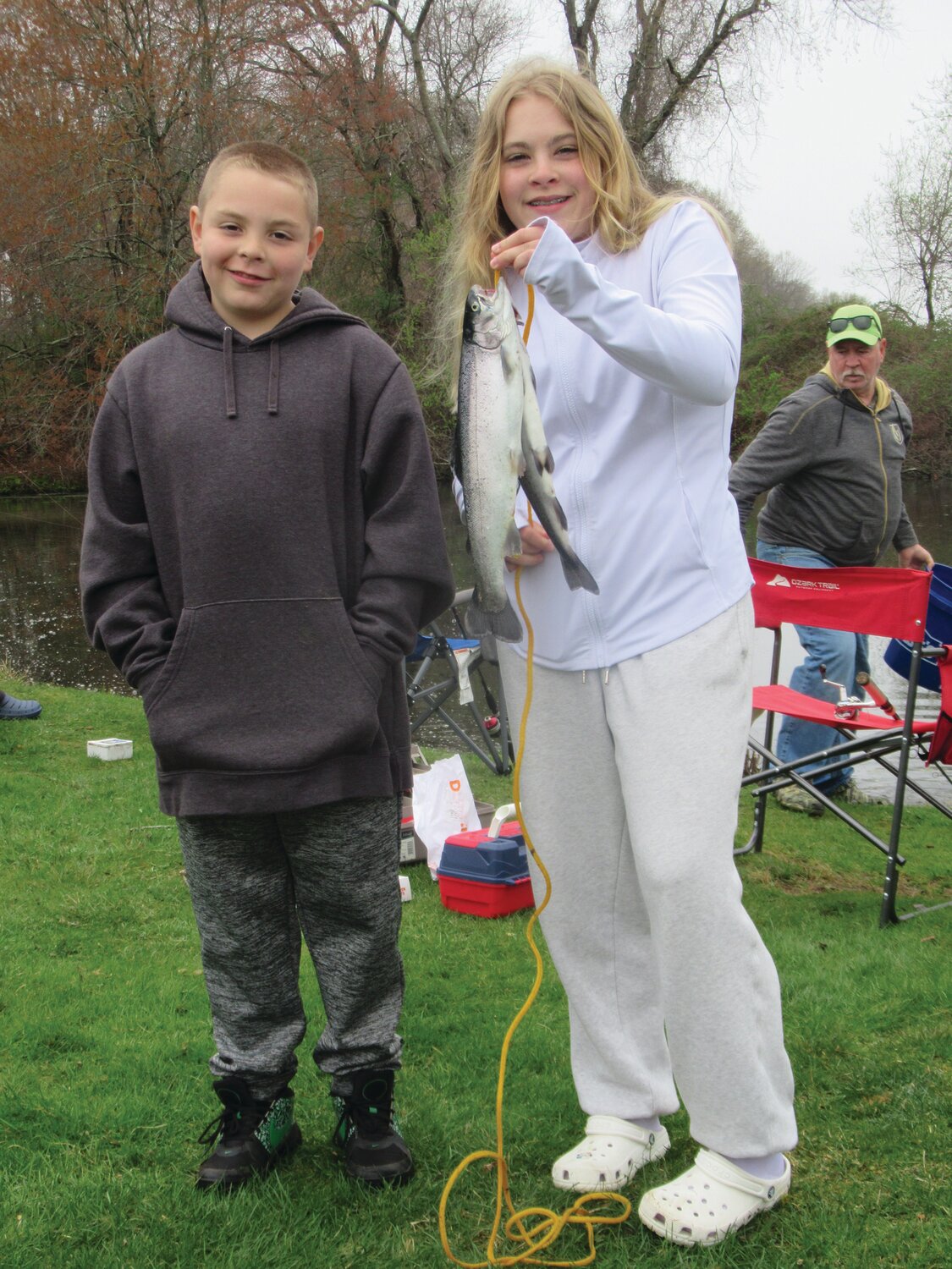 AWESOME ANGLERS: Lana Desroches, 12, who won the Tri-City Elks Kids Fishing Derby with a 16.5-inch catch, is joined by her brother Logan who also caught a 15-inch rainbow trout Sunday at Golden Pond in Warwick. (Warwick Beacon photos by Pete Fontaine)
