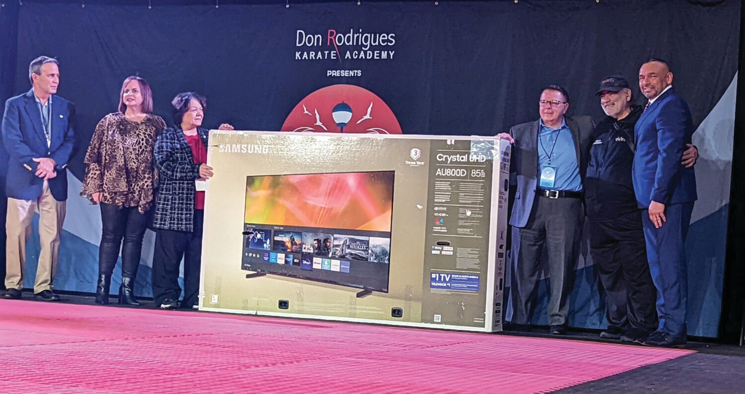 BIG PRIZE: The top supporting school, Leclerc’s Martial Arts from NY, is presented an 85-inch television by Mayor Frank Picozzi, Gina Zangari, Donna Travis, Anthony Zangari, Don Rodrigues and Robert Leclerc.