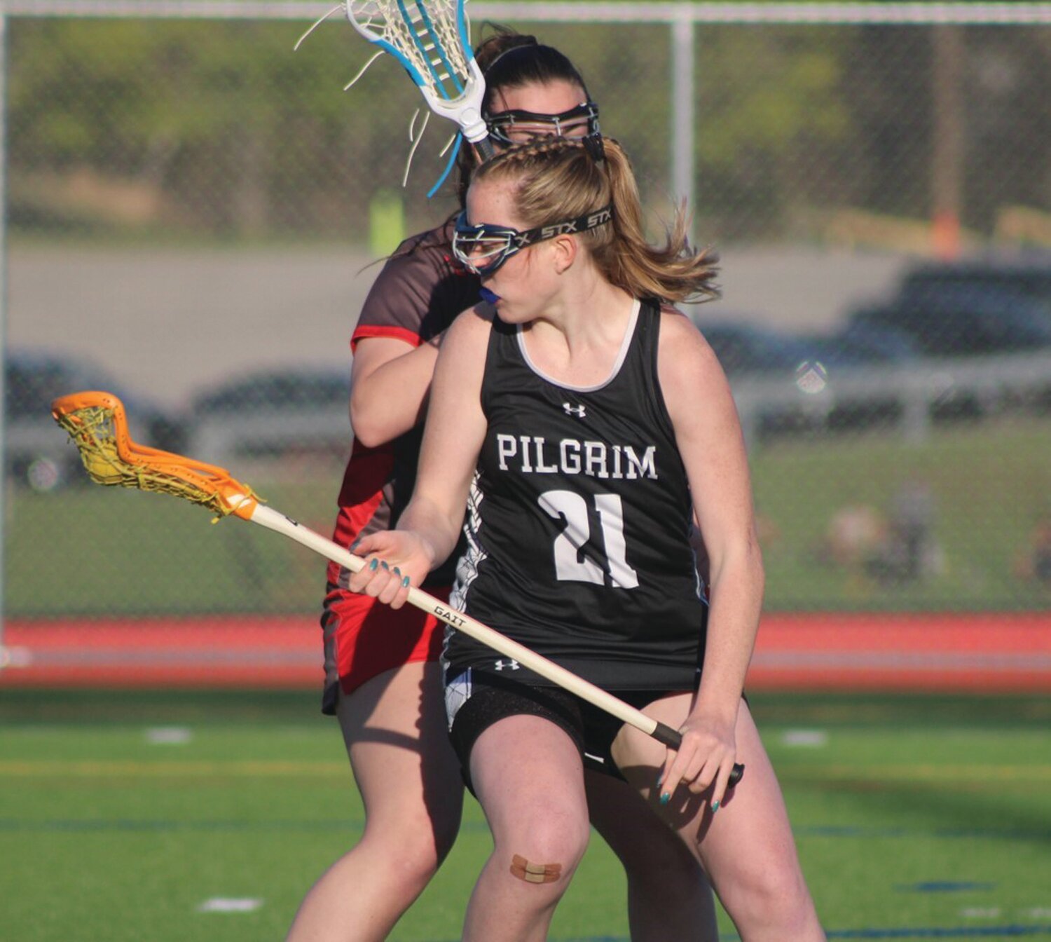 THROUGH TRAFFIC: Pilgrim’s Lily Farrell works past a West defender.