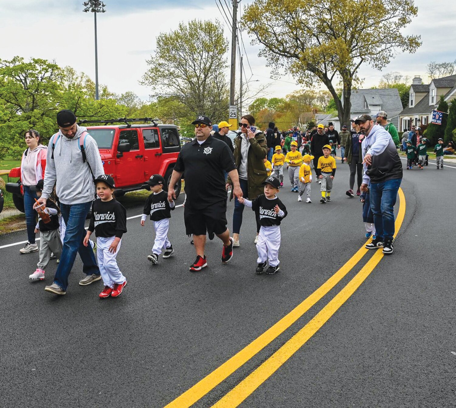MARCHING TO THE FIELD: Many Little Leaguers took park in Warwick North’s Opening Day parade which took place prior to first pitch down at the pit on Post Road.