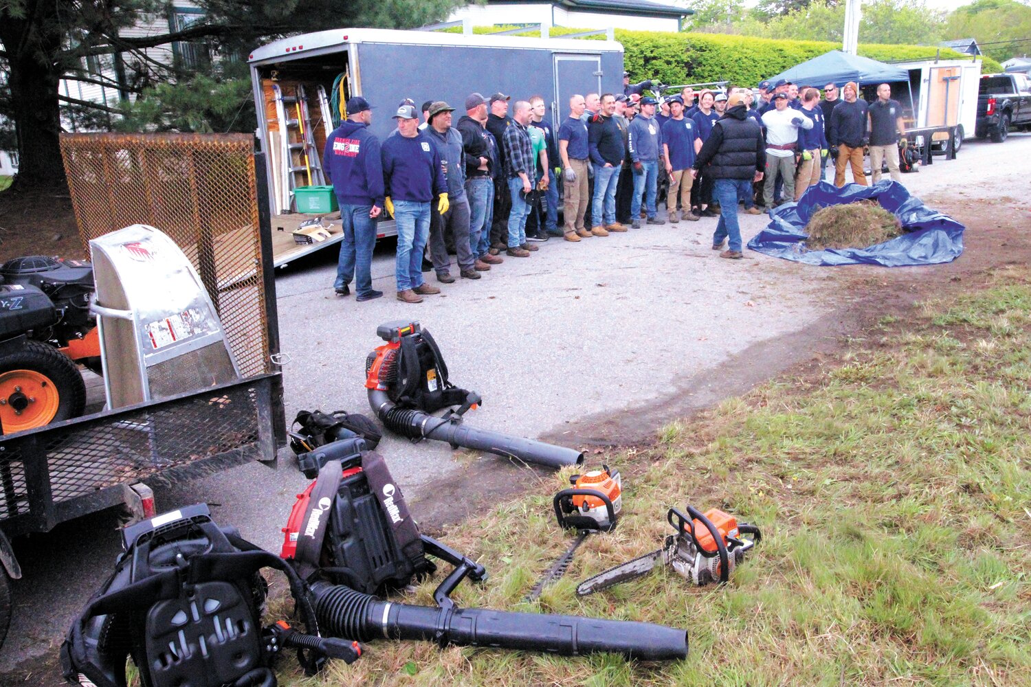 CLEANUP TEAM: Firefighters took a break to lineup for a group shot.