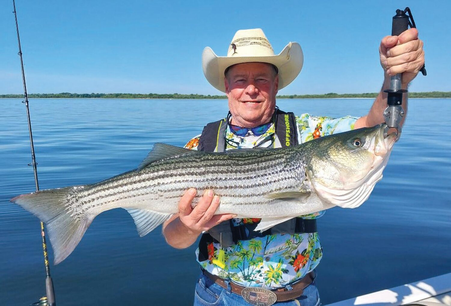 FIRST STRIPES BASS: Tim Rounds of Idaho here on vacation caught this 38-inch striped bass (his first ever) fishing with light tackle at Popasquash Point, Bristol on No Fluke Fishing Charters. (Submitted photo)
