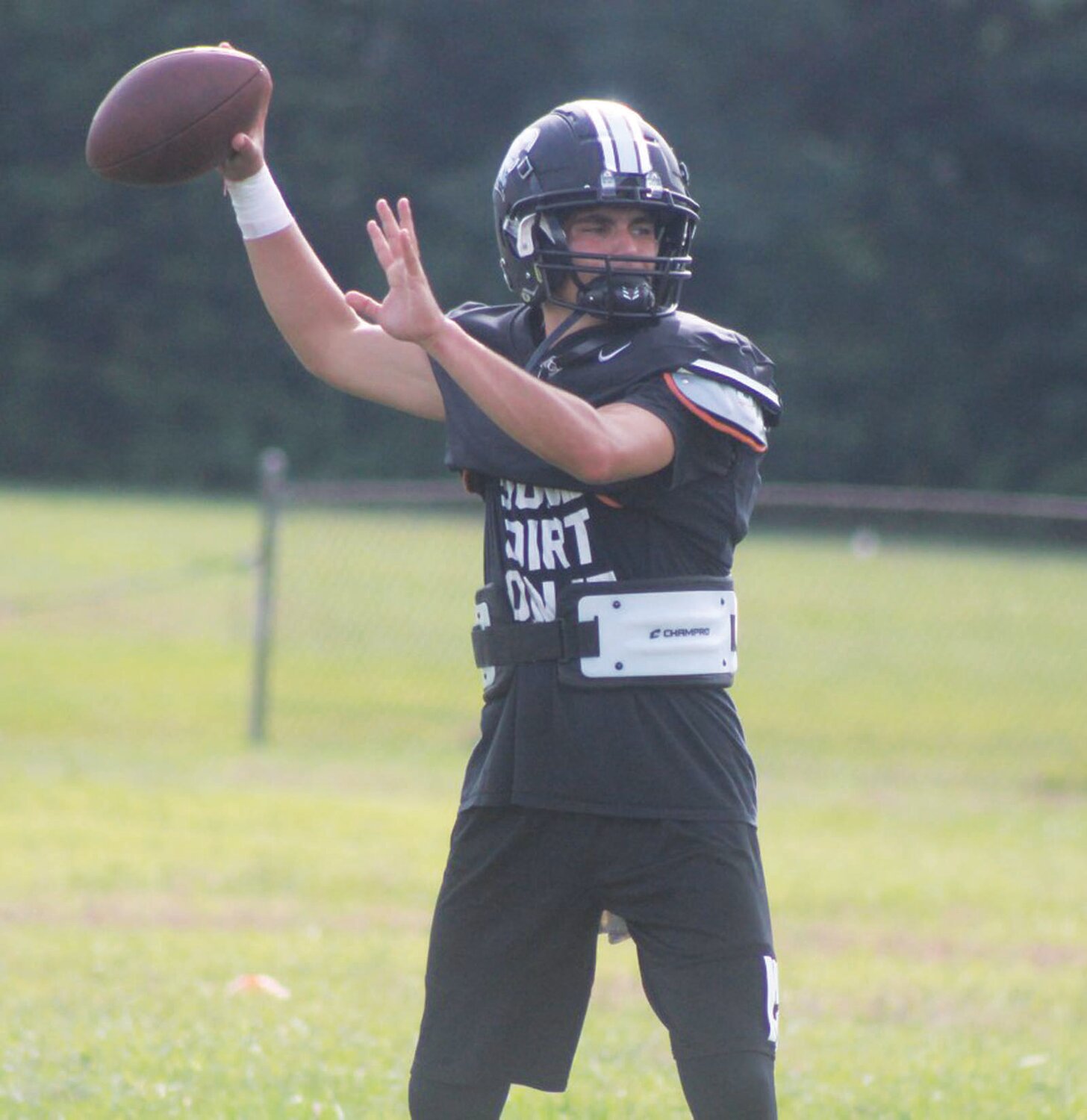 SIGNAL CALLER: Pilgrim senior quarterback Chace Roberts drops back to pass at practice earlier this week.