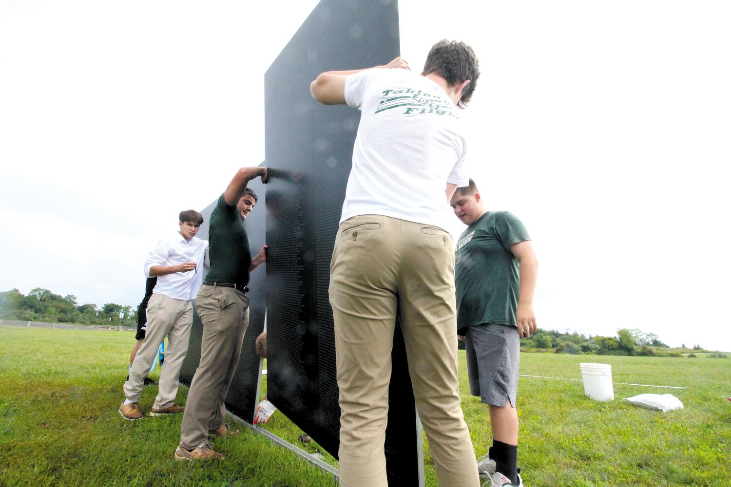 PACKING UP: 
Members of the Hendricken High School leadership Academy helped an Operation Stand Down crew disassemble and pack the wall for its delivery to it next stop in Huntington, WV.