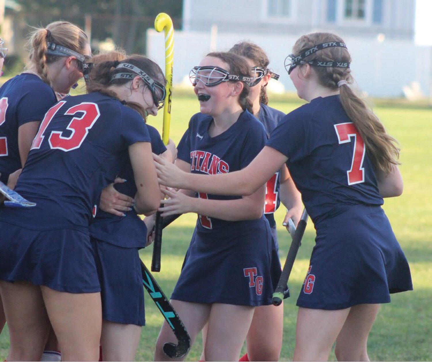 RIVALRY WIN: Members of the Toll Gate field hockey team celebrate after a goal. (Photos by Alex Sponseller)