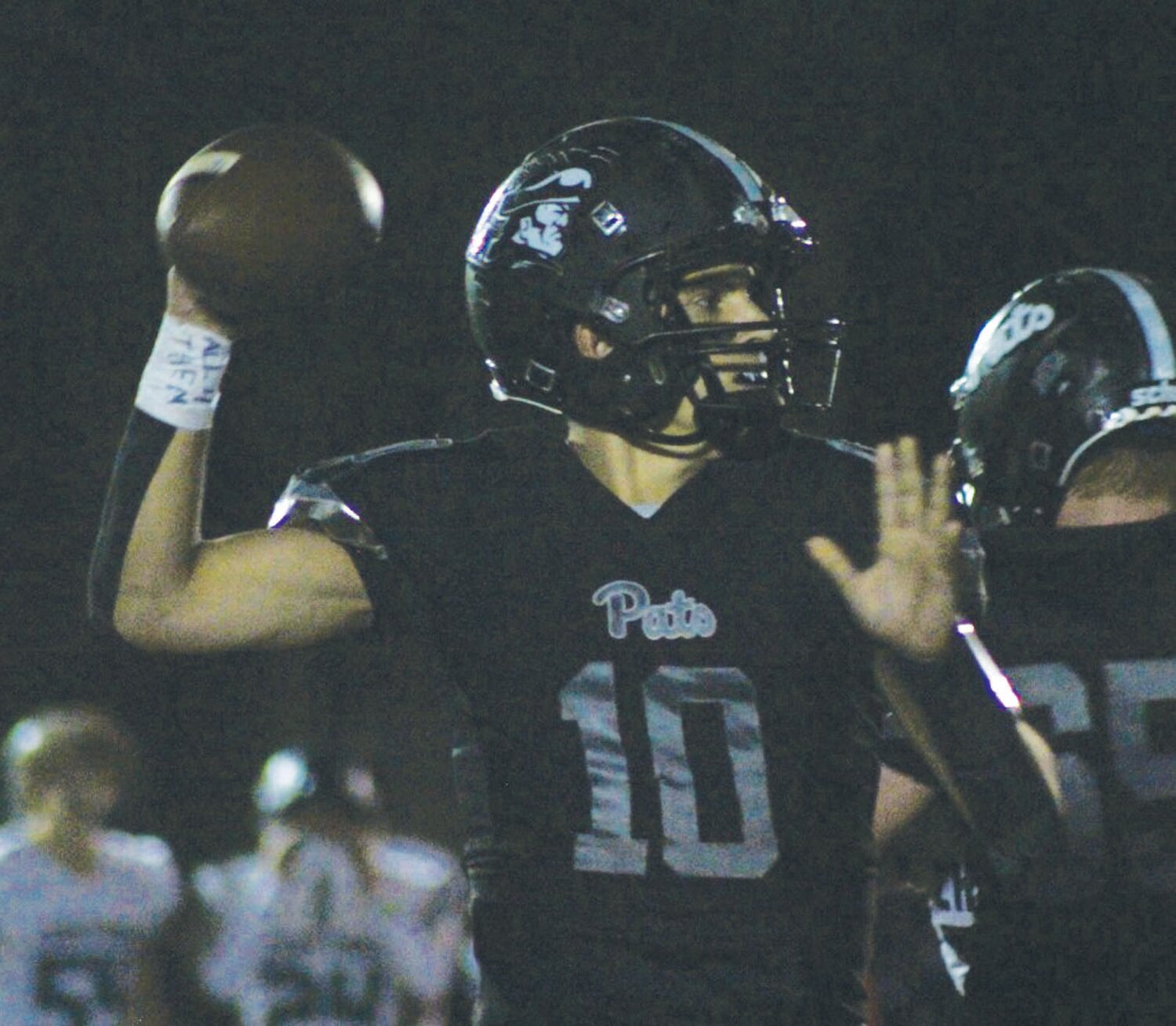 DROPPING BACK: Pilgrim quarterback Chace Roberts looks to pass last week against Ponaganset. (Photo by Alex Sponseller)
