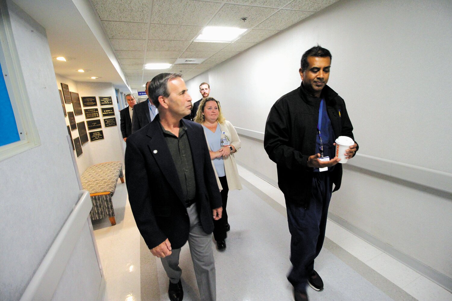 TOUR GUIDE: Paari Gopalakrishnan, MD, MBA, is president and chief operating officer of Kent Hospital led Mayor Frank Picozzi on a tour of the hospital Monday with members of the Kent team. Gopalakrishnan was in his scrubs after having spent several early morning hours in the emergency room – often the busiest time – to get a personal up front view of operations. (Warwick Beacon photo)
