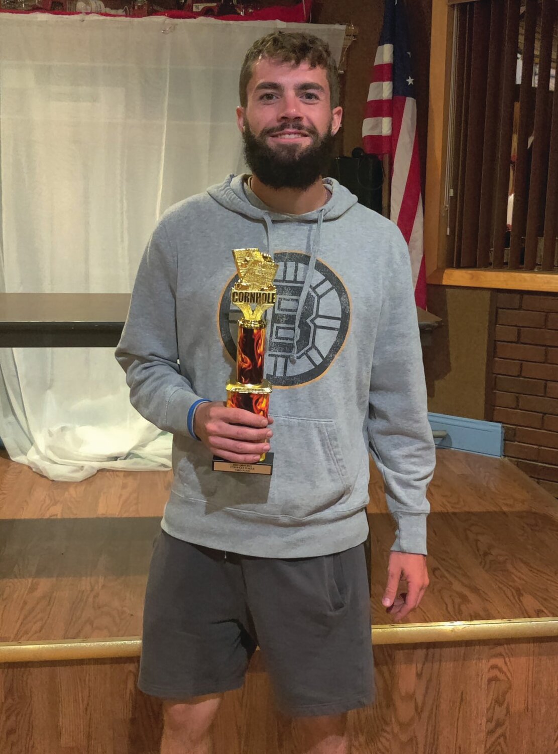TALENTED TOSSER: DJ Kowalik is holding the third trophy during the OBVF’s most recent Corn Hole League awards night.