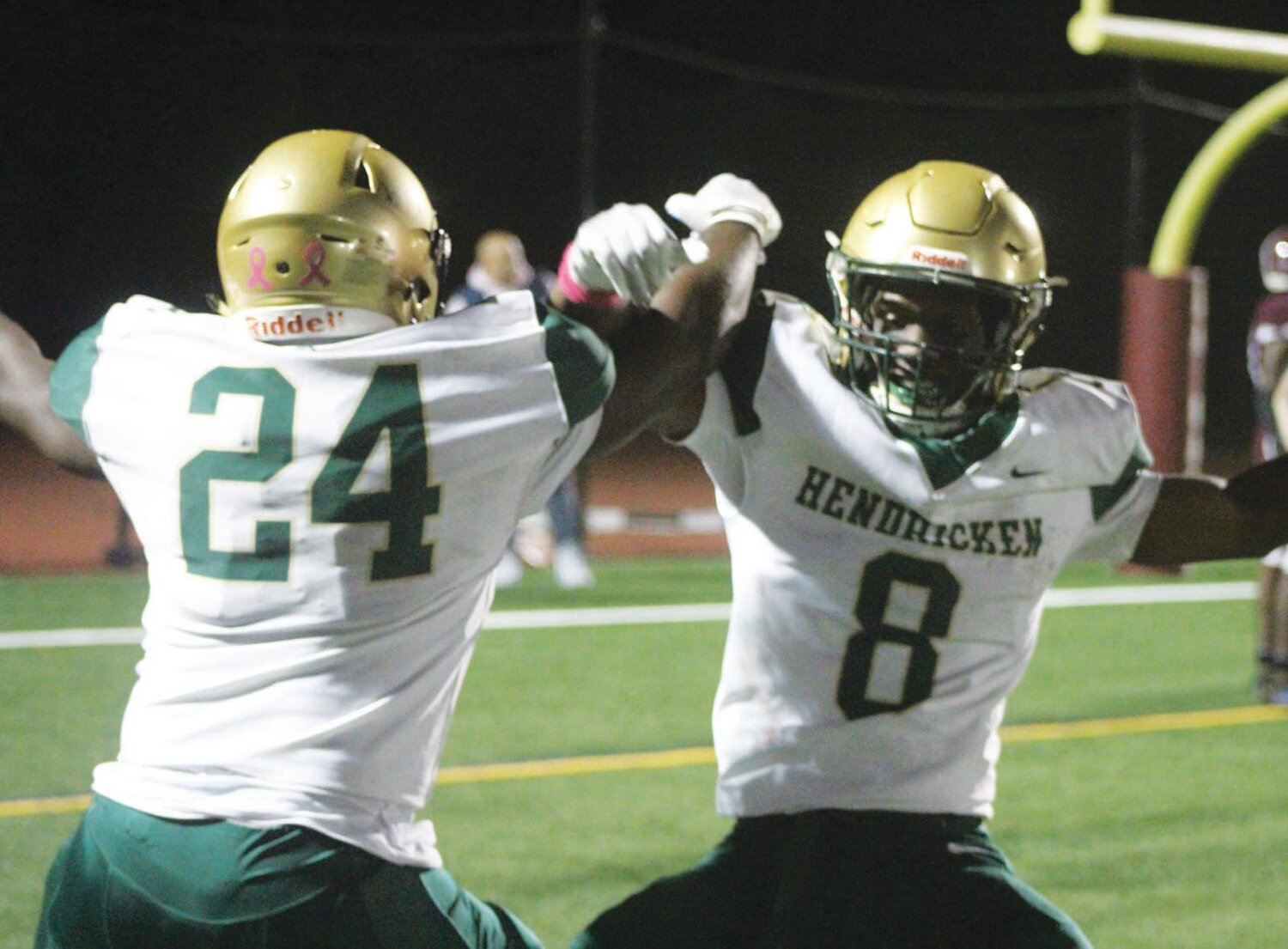 RUNNING TO THE WIN: Bishop Hendricken running backs Oscar Weah (8) and Ronjai Francis celebrate after the former rushed for a touchdown in the second quarter of last week’s state championship rematch against rival La Salle. Weah finished with three scores while the duo combined for over 200 yards on the ground. (Photos by Alex Sponseller)